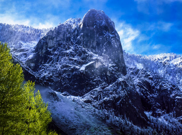 Winter view of Yosemite's Sentinel Rock taken from Merced River bank.Taken in Yosemite National Park, California, USA.