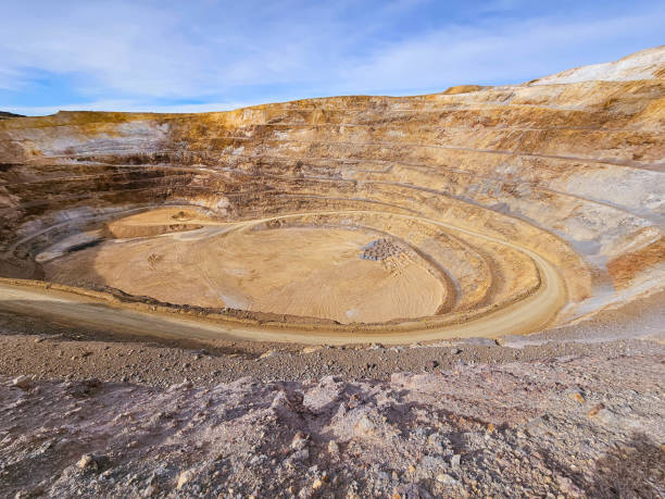 istock Panoramic view of an open pit mine on a sunny morning with clear weather. 2023331741