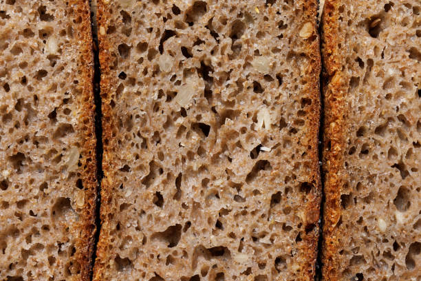 Sección transversal de pan de centeno de masa madre, macro. - foto de stock