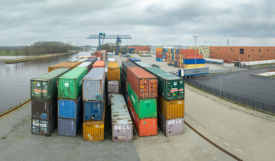 Almelo, Netherlands - February  17, 2024: Small container terminal next to the Twente Canal in the Netherlands