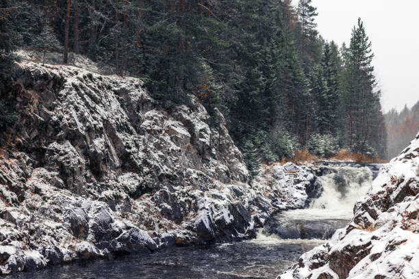 istock Kivach Falls on a cold snowy winter day. Landscape with snowy cascade waterfall at Suna River 2023370010