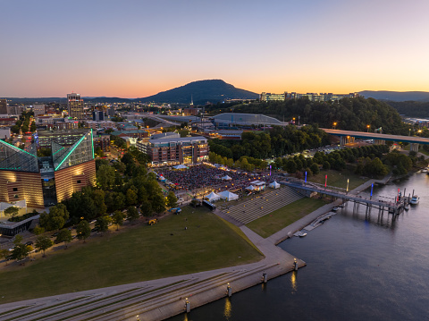 Aerial photo of 3 Sisters Bluegrass Festival on the Tennessee River at Sunset in downtown Chattanooga.