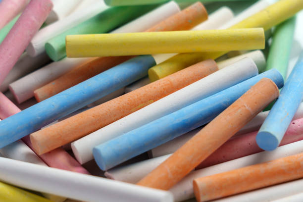 Chalk set with colored artist crayons close up