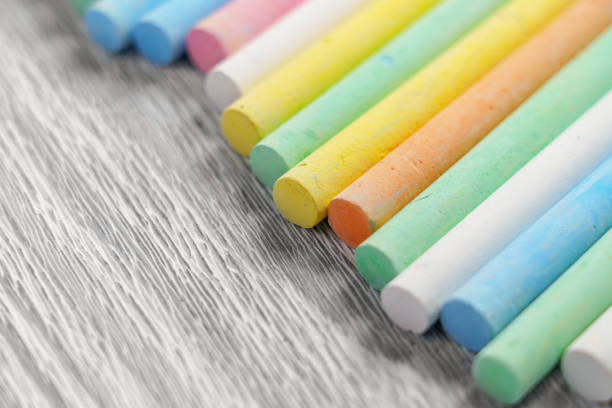 Colorful chalk pastels on a board texture close up. Rainbow colors.