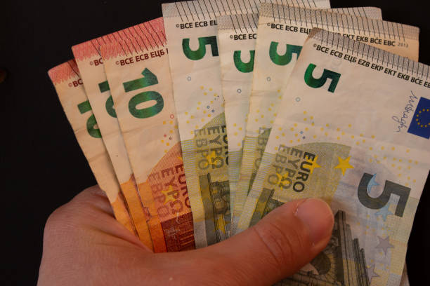 istock Hand holding euro bills 2023399489