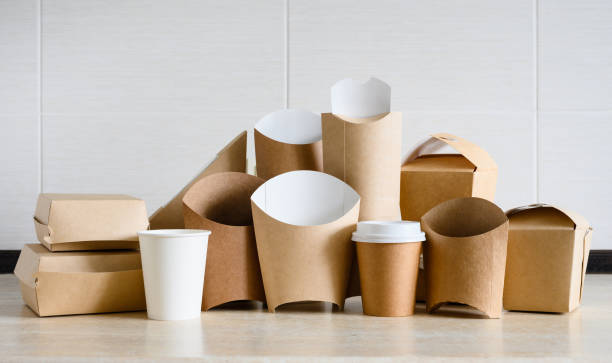 istock Large set of various eco-friendly disposable food packaging on a light background. Panorama with paper utensils for food delivery. 2023401051