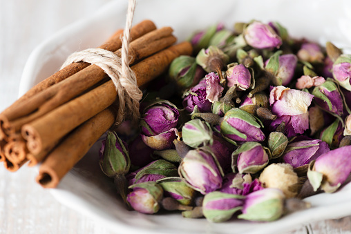 Herbal tea ingredients like dry rose and cinnamon.