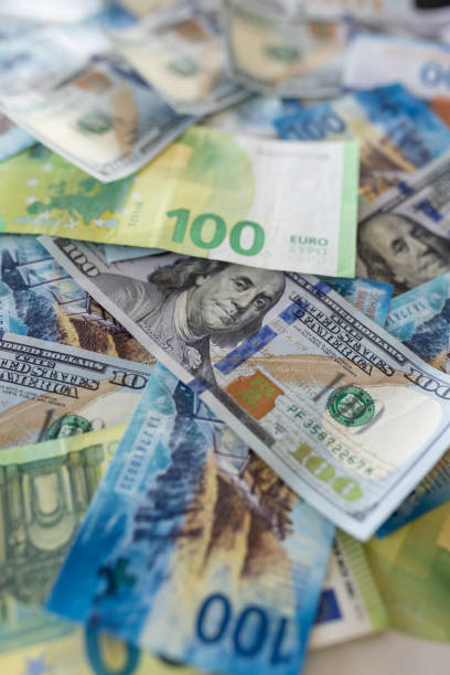 istock A pile of money on the table 2023455415