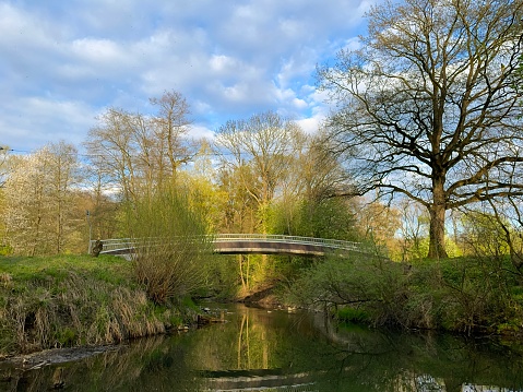 Bridge over the Lučina River in the park in Havířov. Early spring.