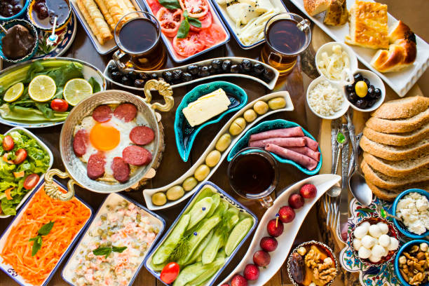 istock Traditional Turkish Breakfast on the wooden table with copper egg pan. 2023482785