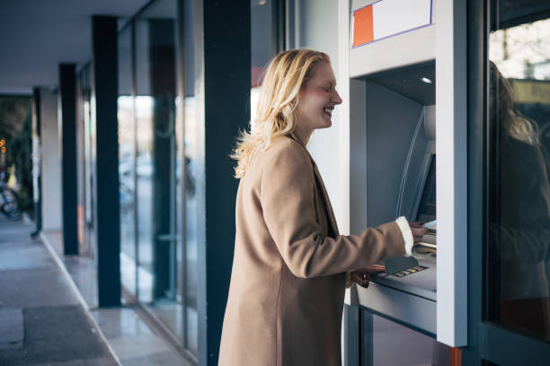 istock Young albino woman uses an ATM. 2023505096