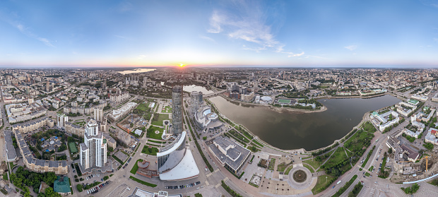 Yekaterinburg city with Buildings of Regional Government and Parliament, Dramatic Theatre, Iset Tower, Yeltsin Center, panoramic view at summer sunset. Yekaterinburg, Russia