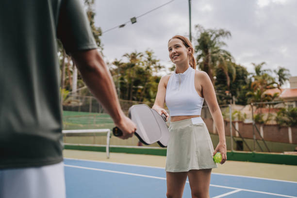 istock Couple playing pickleball 2023549919