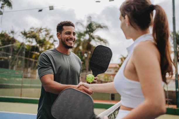 istock Couple playing pickleball 2023558827