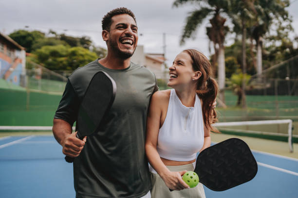 istock Couple playing pickleball celebrate point 2023560374