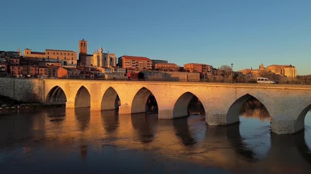 Panoramic view of the historic and monumental city, and medieval bridge, on the banks of the Duero River, Tordesillas, Valladolid, Castilla y León,