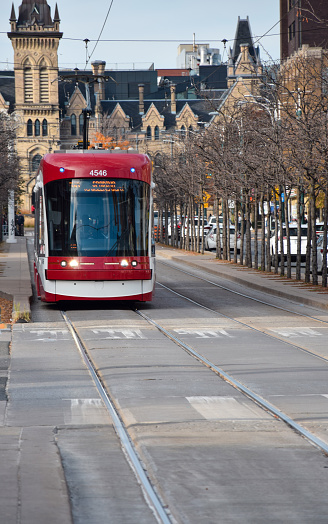 October 30, 2022 - Toronto, Ontario, Canada: Red streetcar downtown Toronto on Spadina Avenue
