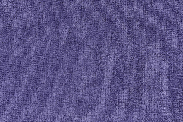 istock Plain purple velours fleecy upholstery fabric texture background. 2023635835
