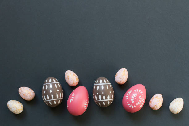 istock Happy Easter concept with elegant Easter eggs decorated with spring ornaments on dark gray background with copy space 2023651281