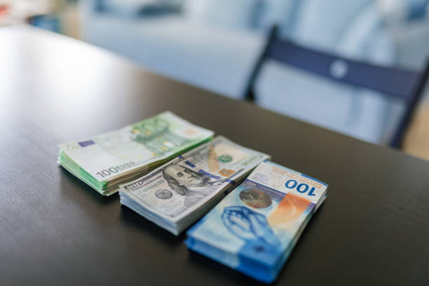 Pile of 50 Swiss franc banknotes -  selective focus
