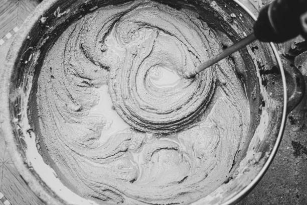 istock knead the solution with a mixer in a bucket of cement and sand 2023654090