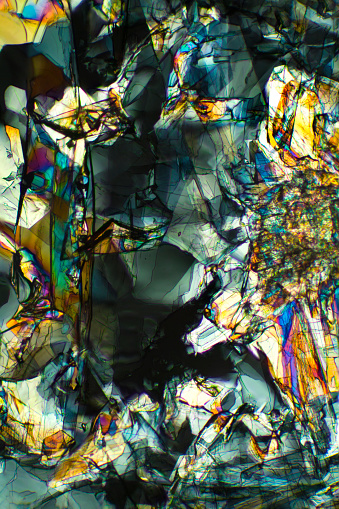 Abstract micrograph of amino acid crystals, methionine, photographed with a polarizing microscope at 40X.