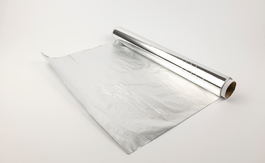 A roll of foil for baking. Aluminum foil. Home baking concept