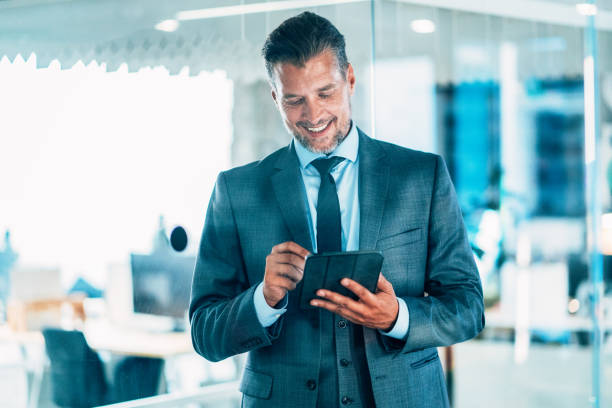 istock Businessman with digital tablet 2023661588