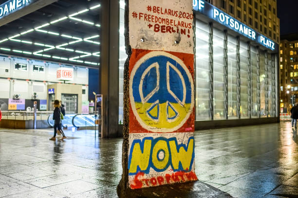 Close-up fragment of the Berlin Wall brought to Georgia from Germany and installed on Europe Square: Tbilisi, Georgia - December 22, 2024.