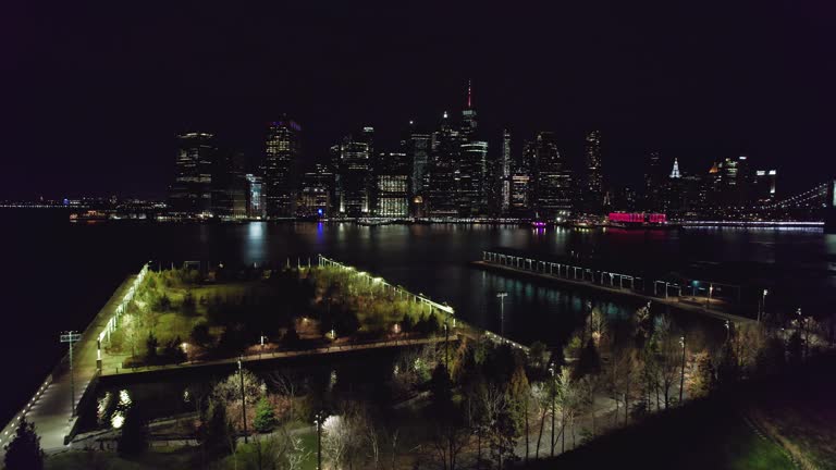 Lower Manhattan NYC from aerial establishing shot at night