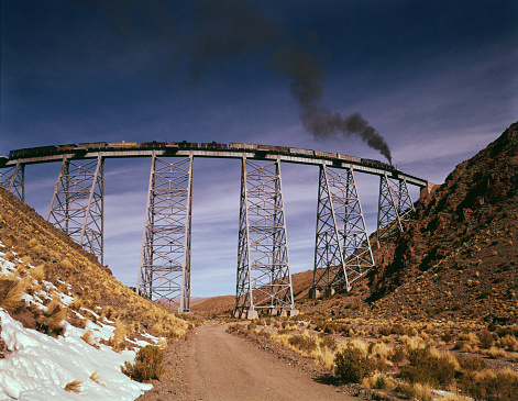 Panoramic view of the La Polvorilla viaduct and the Argentine Puna (Tren de las Nubes or Train to the Clouds, San Antonio de los Cobres, Salta, Argentina) old steam train from 1958