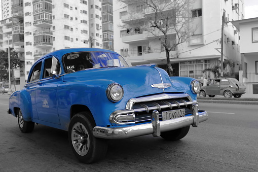 Havana, Cuba-October 07, 2019: Old blue American classic car -almendron, yank tank- Chevrolet Deluxe 4 door Sedan from 1952 stopped on Linea Street near the corner with Avenida Presidentes, El Vedado.