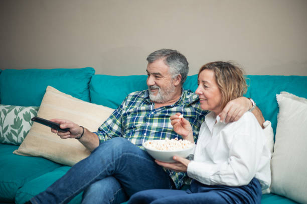 istock Relaxing Together: Senior Couple's TV Time Treat 2023725788