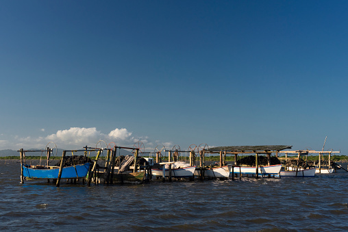 Fisherman's canoes on the banks of the Jaguaruna lagoon on the south coast of the state of Santa Catarina in southern Brazil