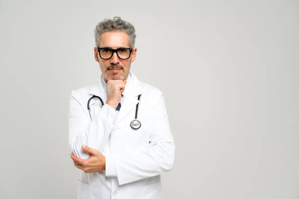 istock Experienced confident senior doctor with grey hair isolated 2023763840
