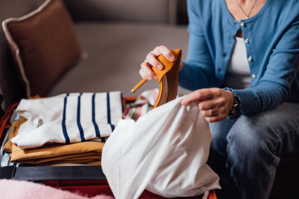 istock Woman Packing Clothes in Suitcase for Trip or Vacation 2023765919