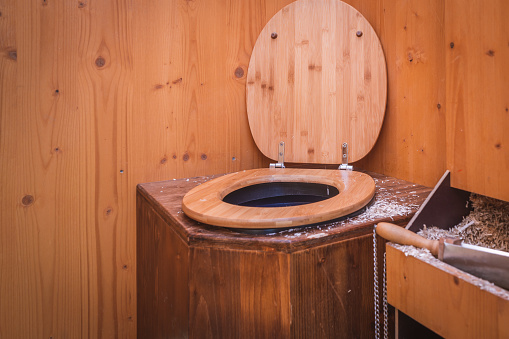 Wooden ecological composting toilet with sawdust