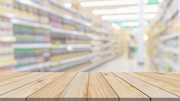 istock Empty wood table top with supermarket blurred background for product display 2023840758