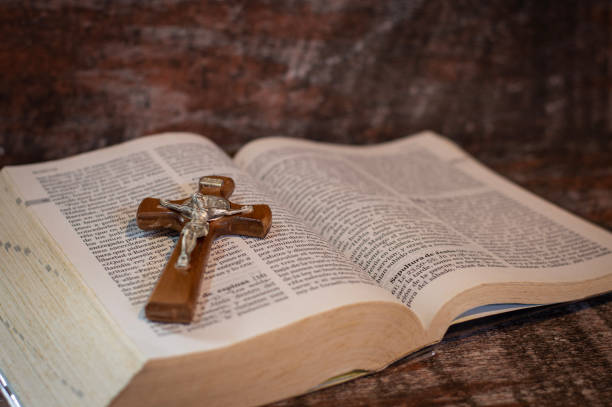 istock Small cross on the bible 2023850593