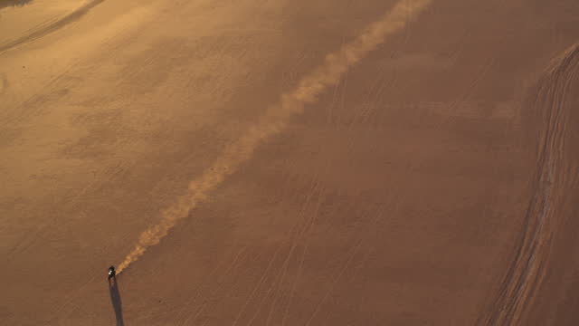 A Drone view of a motorcycle in the desert