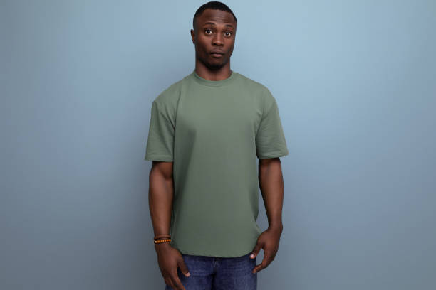 istock young handsome african guy with short haircut dressed in a basic t-shirt against the background with copy space 2023867734