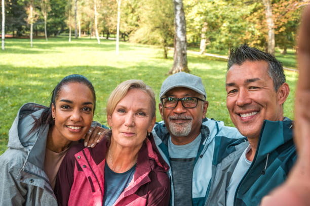 istock Diverse Friends Taking Post-Workout Selfie in Public Park 2023868299