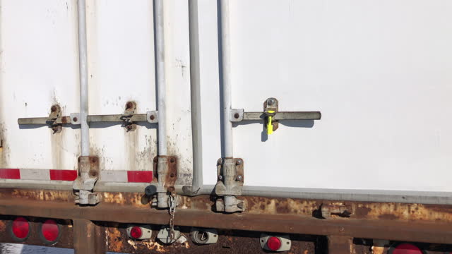 Security seal on cargo shipping trailer.