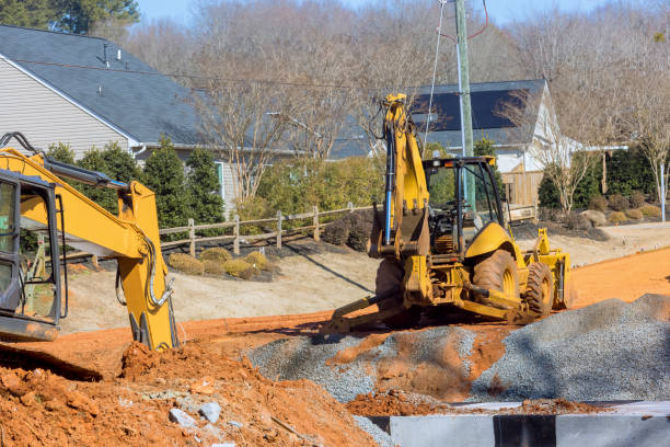 During earthmoving operations to prepare an infrastructure area, an excavator digs a trenches