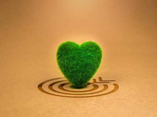 istock Reuse, reduce, recycle. Eco sustainability goal, environmental responsibility, earth protect, love and care concepts. Green grass heart-shape standing on big target icon on recycle paper background. 2023925601