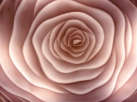 Close up of rose-shaped molded glass in soft focus.