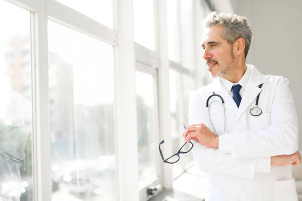 istock Experienced confident senior doctor with grey hair 2023960317