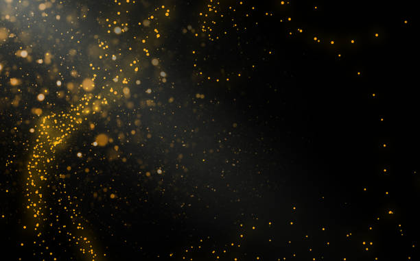 istock Light leak, ray on black background with golden dots wavy form. Glimmering stars, dots and light waves Space for text. 2024121732