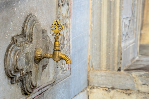 Golden water tap at Istanbul mosque