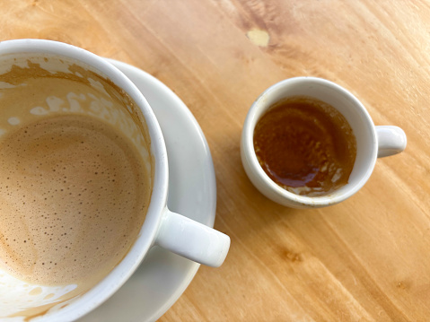 Two Finished Coffees: Latte Cup and Espresso Cup